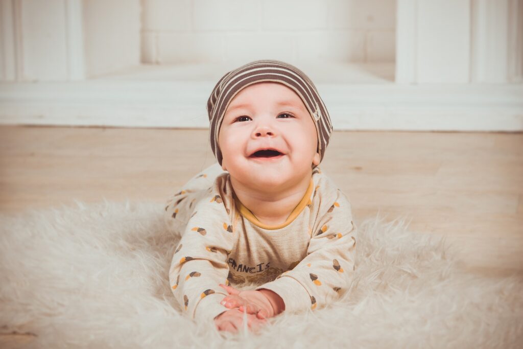 Baby on a furry mat crawling